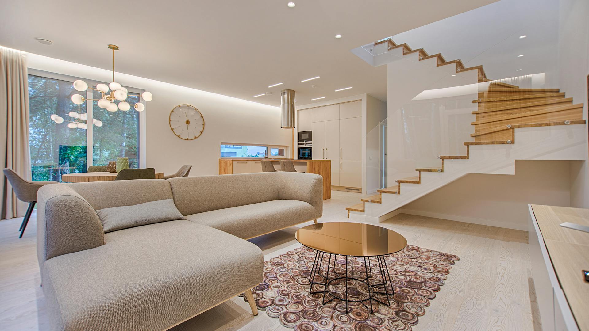 Luxury living room hall with modern staircase and designer lighting